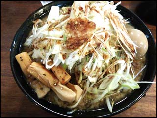 Black Soy Ramen: shredded green onions, boiled cured egg, extra thick bamboo shoots, and lots of garlic.